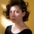 A portrait of a brown-haired woman.